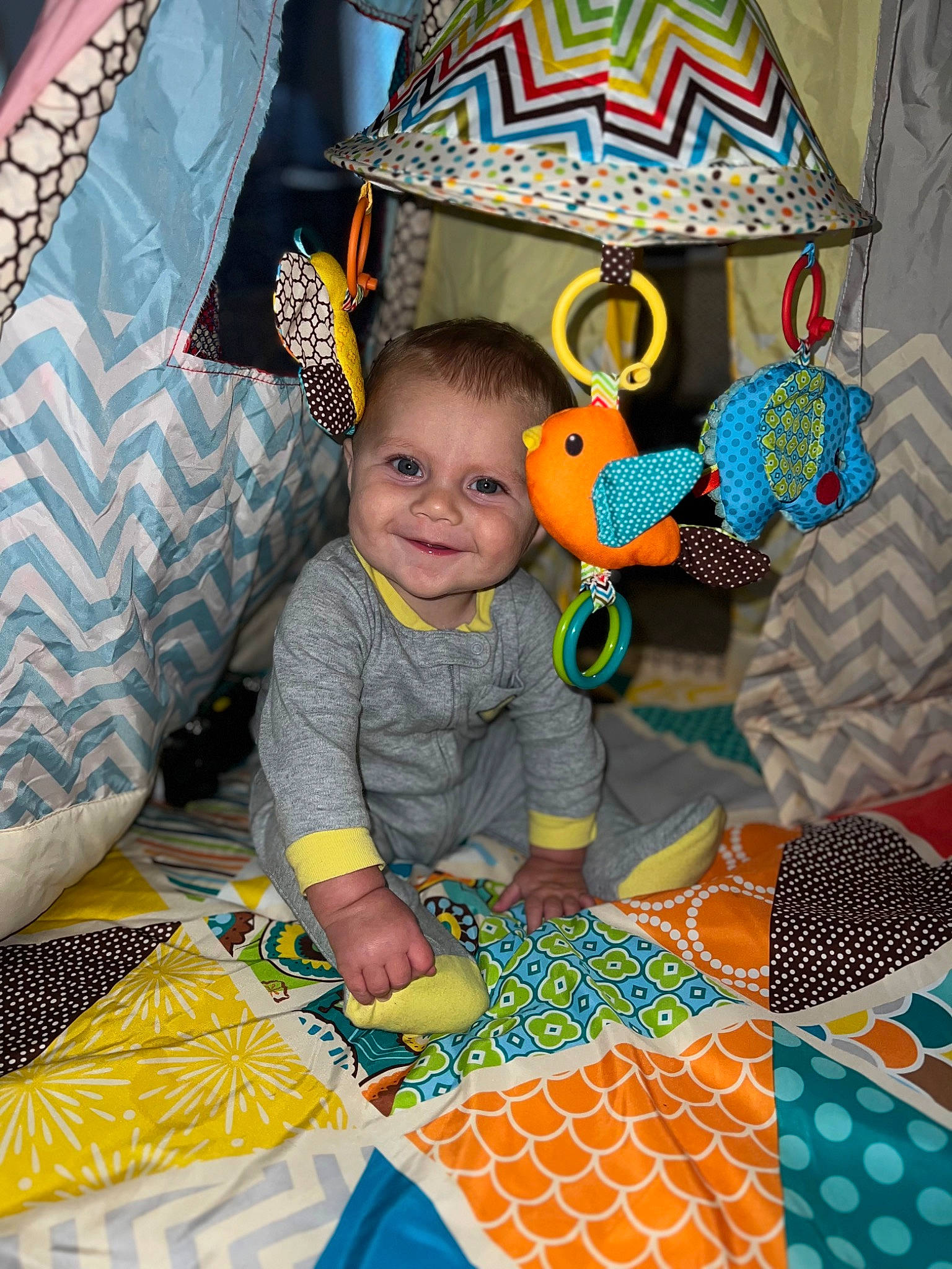 Tate joined the competition — help win amazing prizes! art, baby_products, baby_toys, blue, child, comfort, flooring, fun, happy, joy, linens, pattern, person, play, room, sitting, smile, textile, toddler, visual_arts