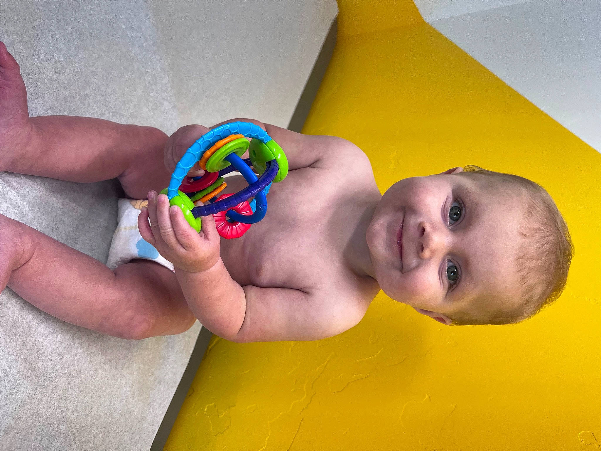 Tate joined the competition — help win amazing prizes! baby, baby_playing_with_toys, baby_products, baby_toddler_clothing, baby_toys, bathing, cheek, chest, child, finger, flooring, fun, happy, joy, leisure, person, play, skin, smile, toddler