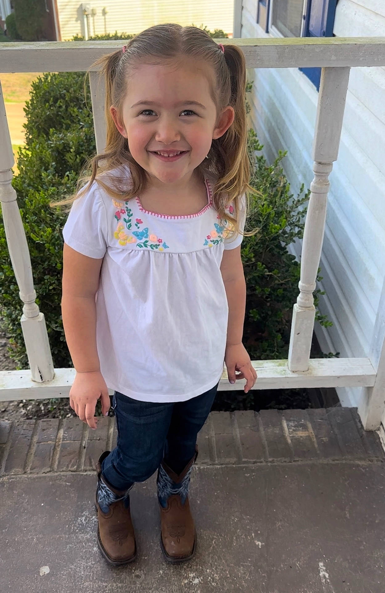 Syrina is registered to the contest to win money with this photo: architecture, blouse, child, clothing, face, female, footwear, girl, head, jeans, pants, person, photography, plant, portrait, pottedplant, shoe, sleeve, standing, t_shirt