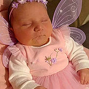 Ava participe au concours pour gagner de l'argent avec cette photo : adorable, baby, child, costume, cute, fairy_wings, flower, hand, headband, indoors, infant, long_sleeves, newborn, peaceful, pink_dress, portrait, resting, sleeping, soft_lighting, tulle_skirt