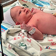 Sadie Lynn is registered to the contest to win money with this photo: baby, bassinet, blanket, cap, child, cute, footprint_pattern, hospital, hospital_bed, hospital_room, id_bracelet, infant, lying_down, medical, newborn, patient, skin, sleepwear, striped, towel