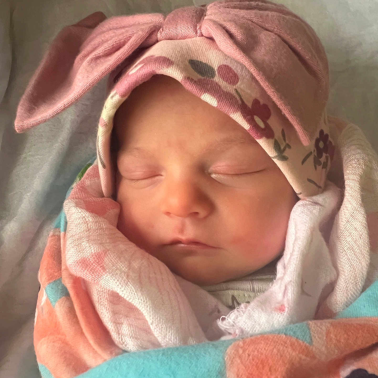 Sadie Lynn joined the competition — help win amazing prizes! baby, blanket, bow, child, closeup, cute, face, floral, hat, indoors, infant, newborn, peaceful, pink, portrait, resting, skin, sleeping, soft, wrapped