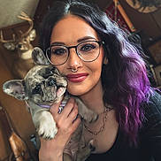 Luna Nova joined the competition — help win amazing prizes! black_clothing, closeup, cozy, deer_head, dog, face, french_bulldog, glasses, hand, indoor, necklace, nose_ring, pet, portrait, puppy, purple_hair, rustic, smile, woman, wood_wall