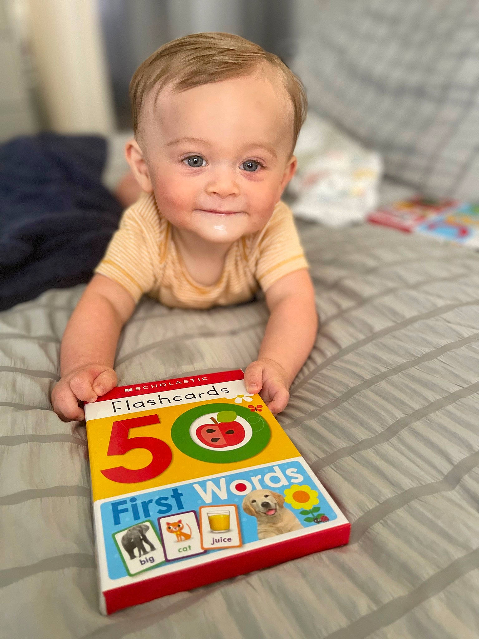 Giovanni is registered to the contest to win money with this photo: baby, baby_playing_with_toys, baby_products, baby_toddler_clothing, cheek, child, face, flooring, fun, happy, joy, person, play, room, sitting, sleeve, smile, t_shirt, toddler, wood