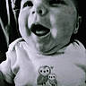 Shaylynn is registered to the contest to win money with this photo: baby, infant, smiling, black_and_white, close_up, face, clothing, cute, happy, child, portrait, young, expression, owl, text, shirt, infant_clothing, love, soft_focus, monochrome