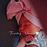 baby, sleeping, infant, headband, pink_bow, clothing, hand, face, cute, peaceful, indoors, closeup, portrait, child, soft_lighting, text_overlay, heart_emoji, cozy, resting, newborn