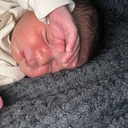 Isaac participe au concours pour gagner de l'argent avec cette photo : newborn, baby, sleeping, hand, face, blanket, cozy, infant, skin, clothing, cute, rest, peaceful, texture, soft, portrait, closeup, young, toddler, child