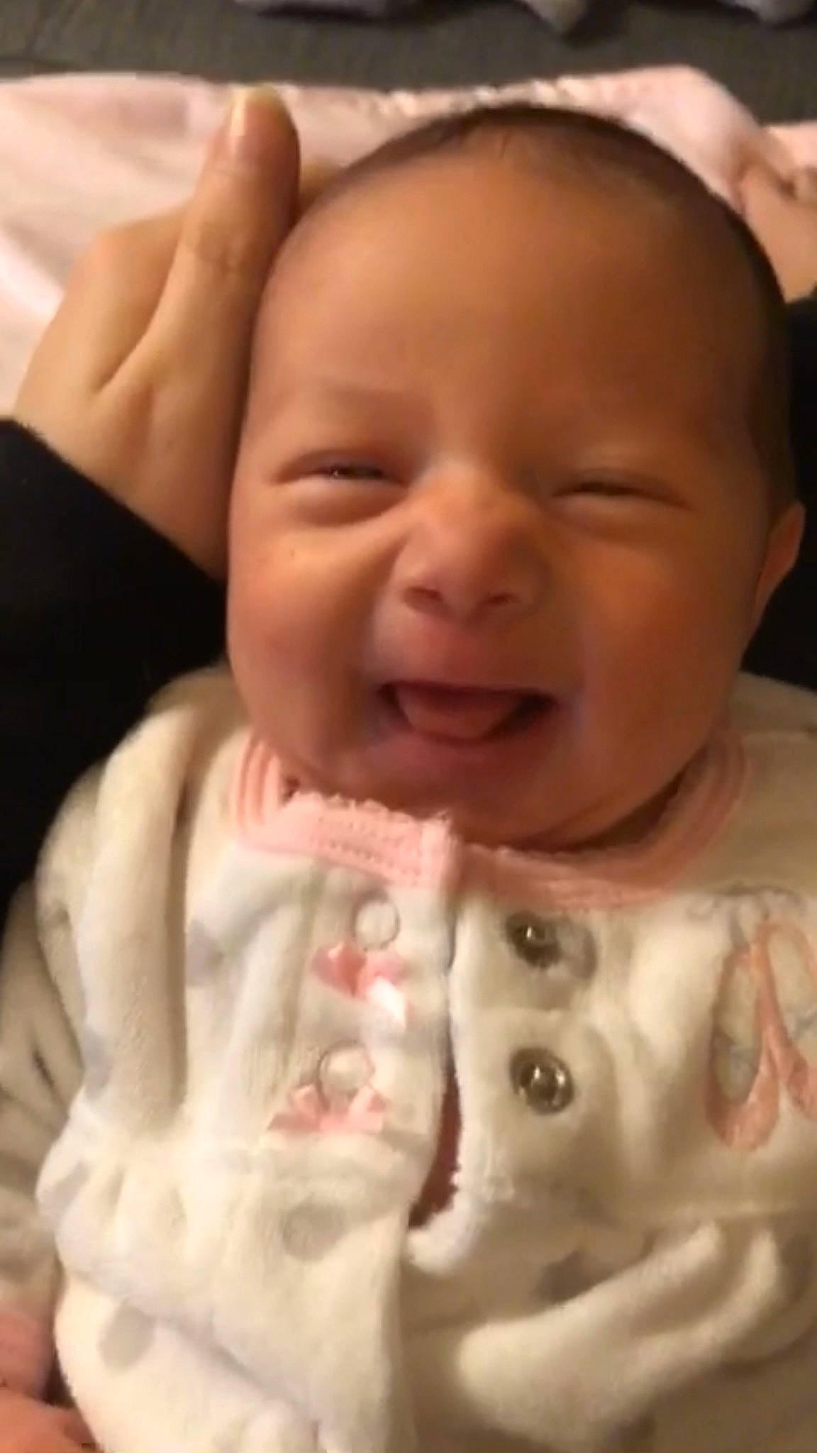 Capri is registered to the contest to win money with this photo: baby, baby_toddler_clothing, cheek, child, chin, eyebrow, eyelash, facial_expression, forehead, iris, jaw, laugh, lip, nail, organ, people, person, skin, toddler, tongue