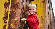 Sebastian joined the competition — help win amazing prizes! child, boy, smiling, outdoor, portrait, industrial, machinery, ladder, rust, peeling_paint, yellow, red_shirt, blue_jeans, blond_hair, climbing, adventure, railway, vehicle, weathered, photography