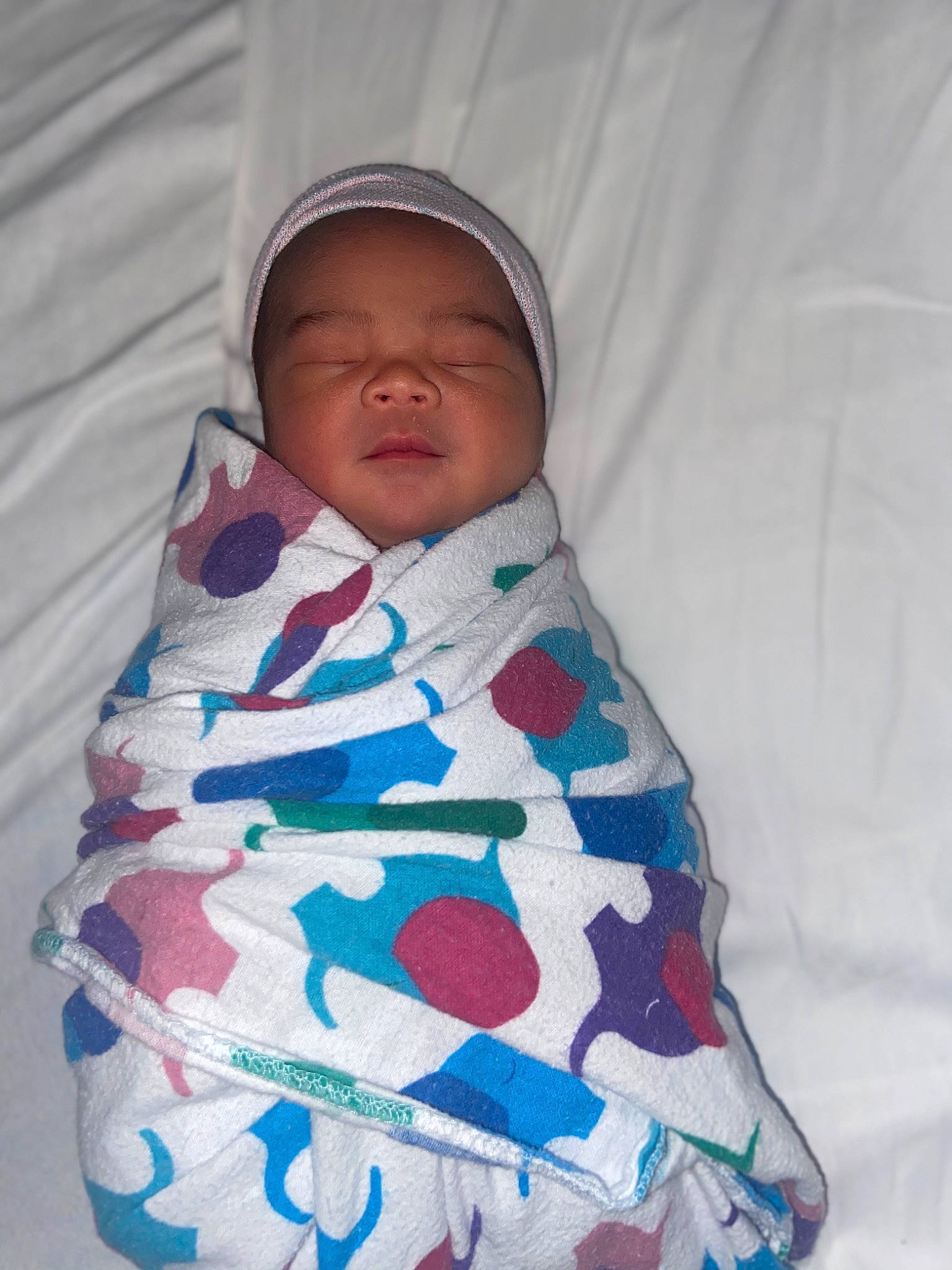 Kadyn is registered to the contest to win money with this photo: baby, baby_products, baby_sleeping, baby_toddler_clothing, bedtime, child, comfort, electric_blue, linens, magenta, pattern, person, room, sleeve, textile, toddler