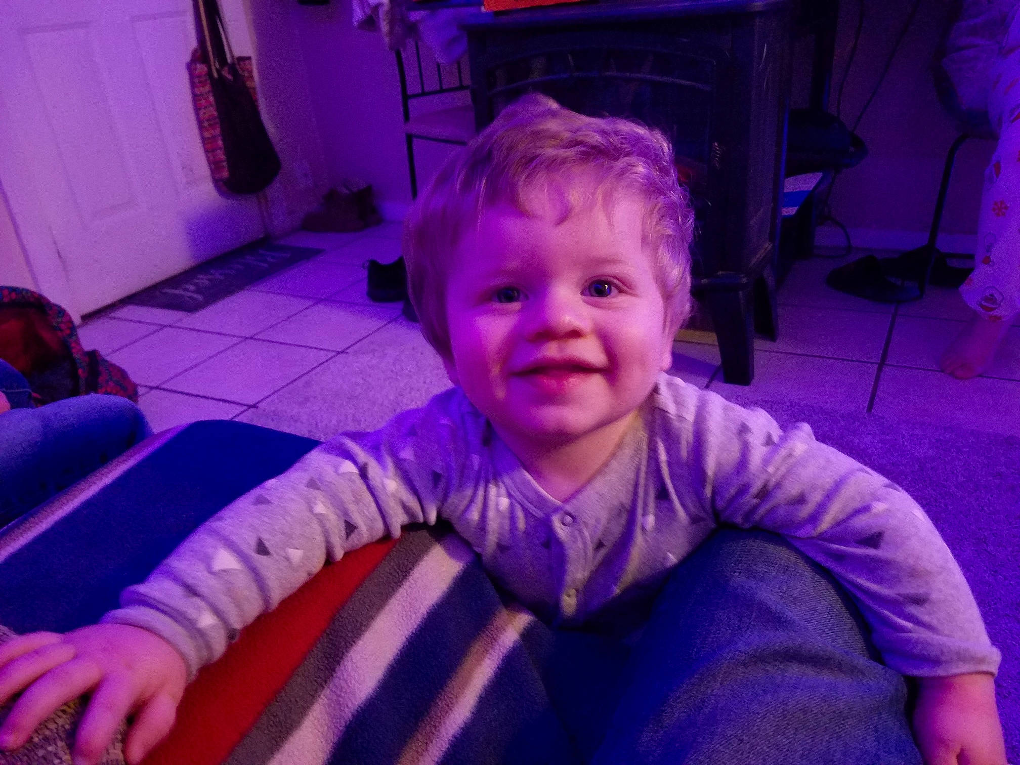 Alex is registered to the contest to win money with this photo: baby, baby_toddler_clothing, cheek, child, electric_blue, eye, flooring, fun, happy, iris, joy, magenta, person, pink, purple, room, sitting, smile, snapshot, standing