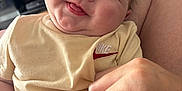 Teddy joined the competition — help win amazing prizes! baby, beige, blurred_background, child, closeup, clothing, cute, expression, face, fingers, hand, holding_hand, indoor, infant, person, portrait, skin, smiling, television, tongue_out