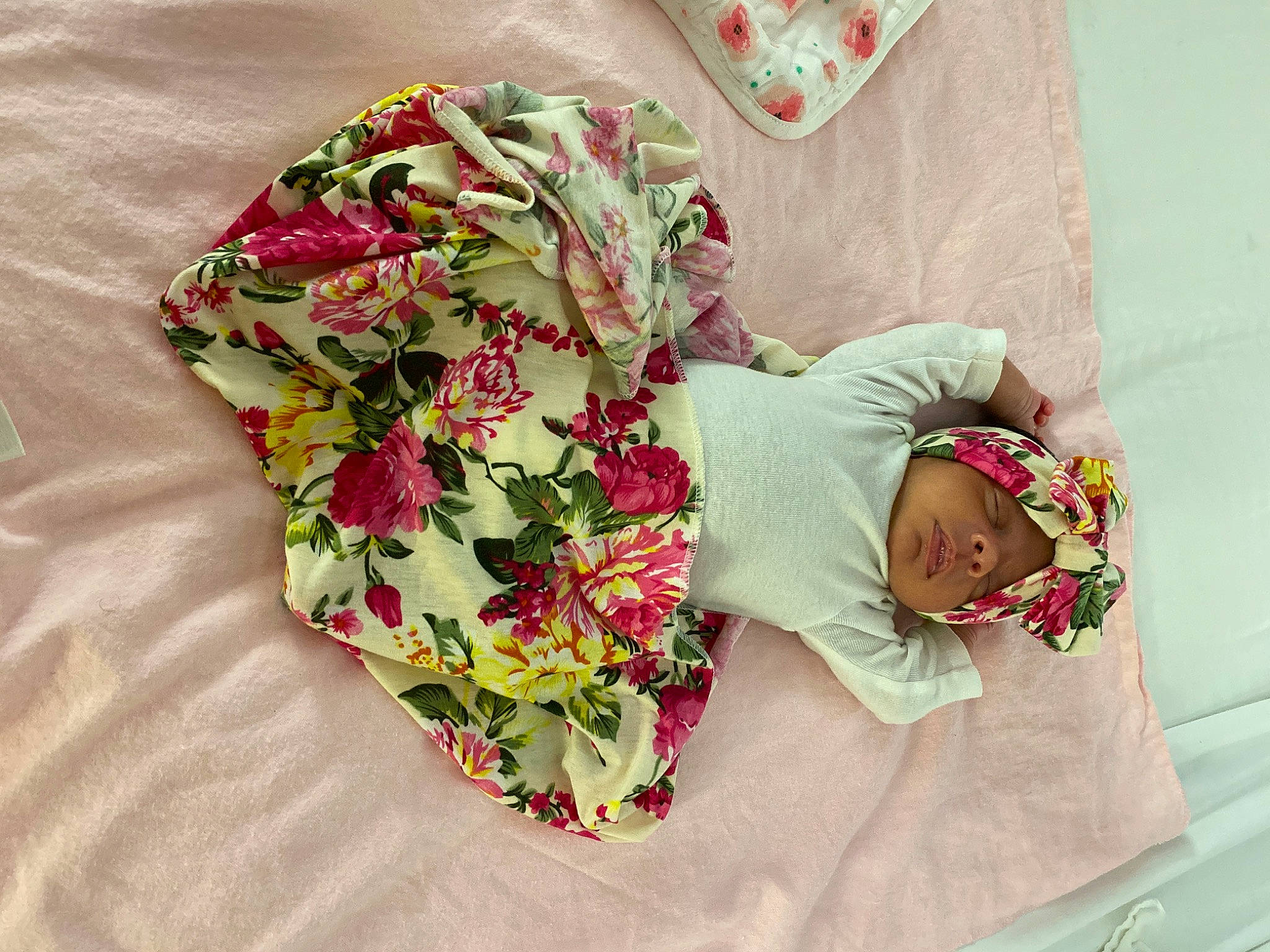 Jaylani joined the competition — help win amazing prizes! baby, baby_toddler_clothing, child, floral_design, flower, headgear, headwear, linens, outerwear, pattern, person, plant, product, sleeve, textile, toddler