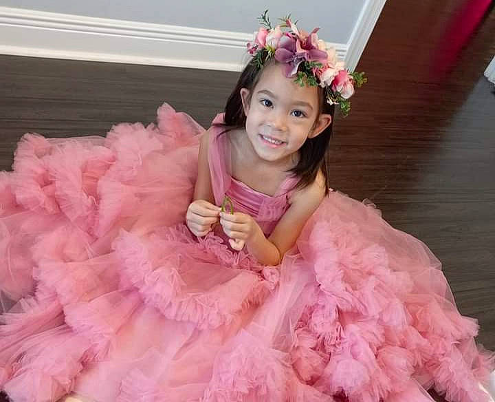 Sophia is registered to the contest to win money with this photo: ballet_tutu, costume, dress, embellishment, event, facial_expression, fashion, flower, fun, hairstyle, happy, headpiece, headwear, joy, magenta, person, petal, pink, ruffle, sleeve
