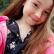 Lucinda participe au concours pour gagner de l'argent avec cette photo : child, girl, smiling, portrait, long_hair, outdoor, nature, tree, greenery, pink_jacket, floral_dress, face, happy, earring, casual_clothing, daylight, person, cute, young, fashion