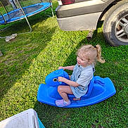 Jalynn joined the competition — help win amazing prizes! blue, car, casual, child, cooler, daylight, grass, grass_lawn, happy, outdoor, person, playtime, rocking_horse, shoes, smiling, sunny, tire, toy, trampoline, young_child