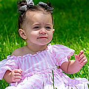 Nevaeh joined the competition — help win amazing prizes! toddler, child, grass, outdoor, dress, pink, striped, pigtails, hair_bows, sunlight, greenery, cute, baby, sitting, nature, portrait, smile, happy, young, person