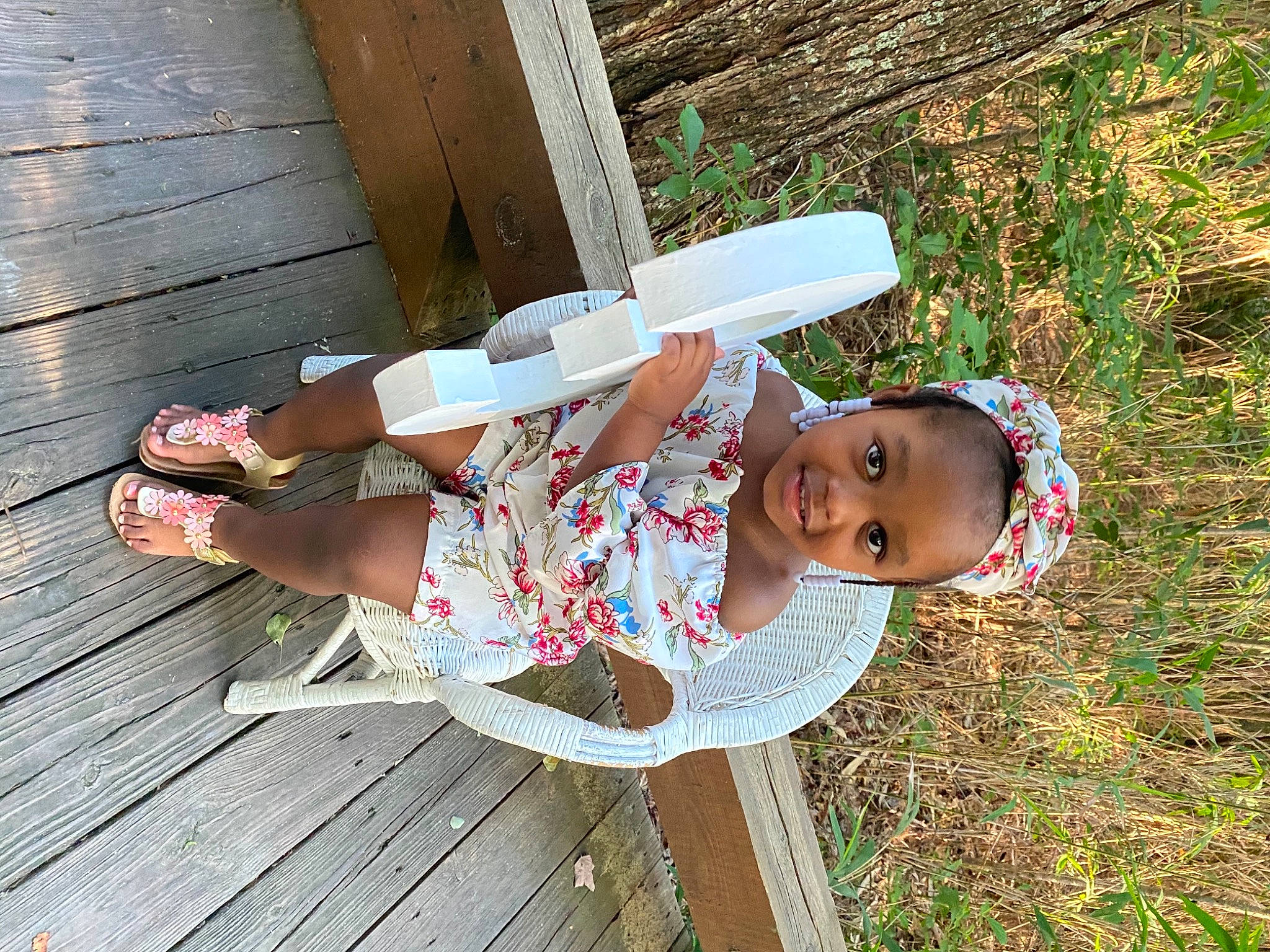 Kamani joined the competition — help win amazing prizes! baby, baby_toddler_clothing, child, foot, fun, grass, happy, hardwood, hat, human_leg, joy, leisure, pattern, people_in_nature, person, plant, sandal, thigh, toddler, tree