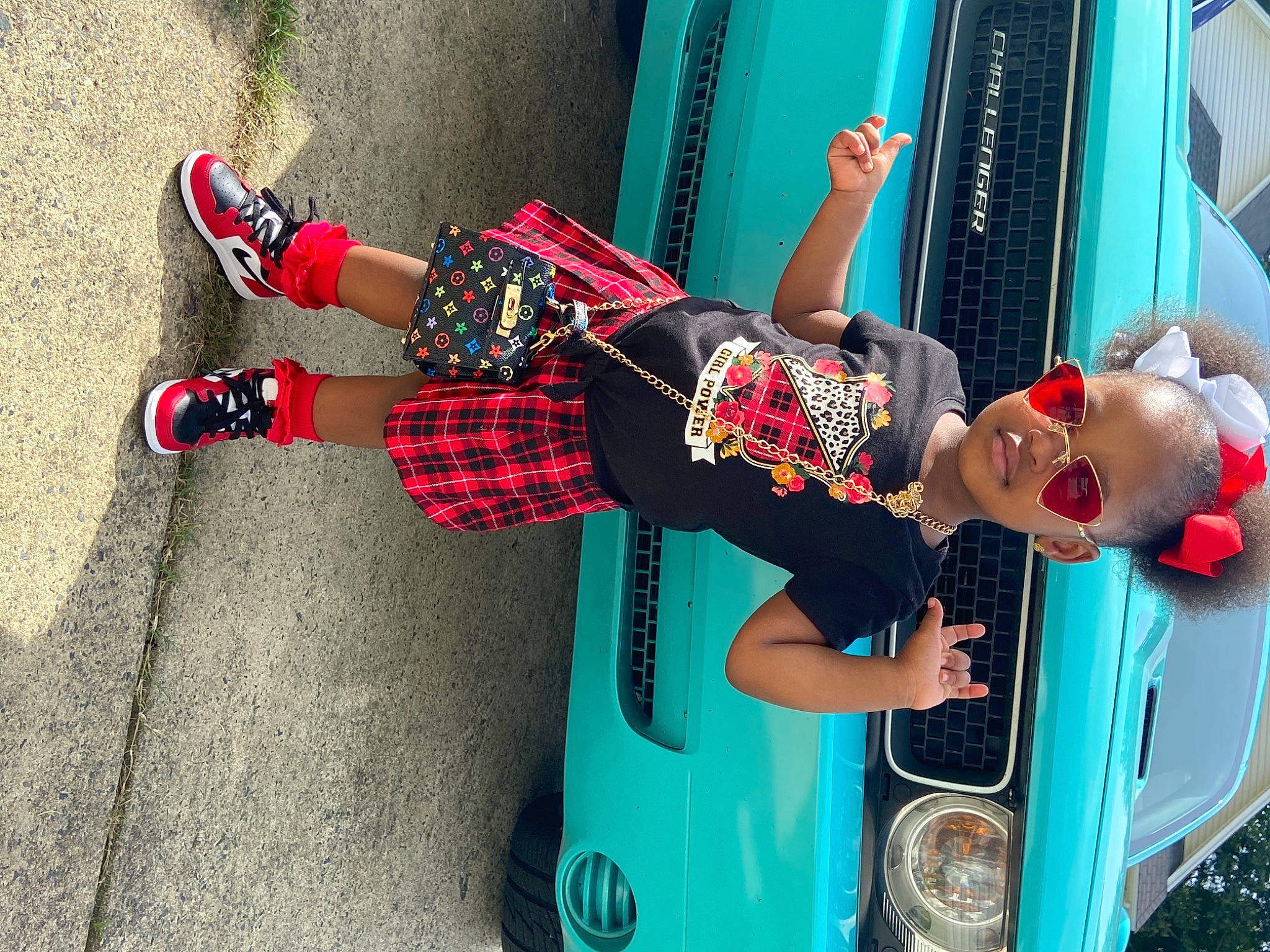 Kamani joined the competition — help win amazing prizes! automotive_design, automotive_exterior, automotive_lighting, blue, bumper, car, cool, footwear, leg, motor_vehicle, person, recreation, red, shoe, street_fashion, sunglasses, tartan, tire, vehicle, vehicle_door