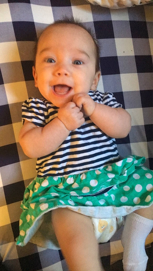 Alice joined the competition — help win amazing prizes! baby, baby_toddler_clothing, cheek, child, comfort, facial_expression, finger, flooring, green, hairstyle, happy, pattern, person, photograph, sleeve, smile, standing, t_shirt, thigh, thumb