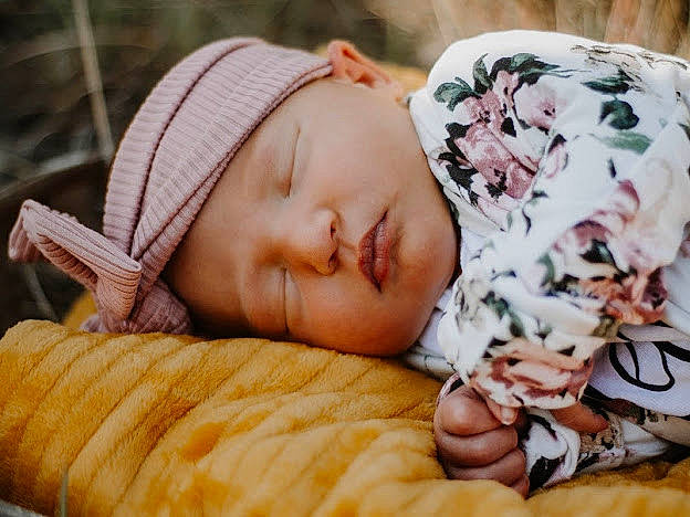 Tatum joined the competition — help win amazing prizes! baby, baby_sleeping, baby_toddler_clothing, cap, cheek, child, comfort, couch, facial_expression, grass, happy, headwear, linens, mammal, organ, people, person, product, skin, textile