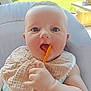 baby, infant, spoon, bib, blue_eyes, cheeks, hand, cushion, chair, indoor, window, greenery, food, cute, portrait, child, feeding, soft_light, smile, skin