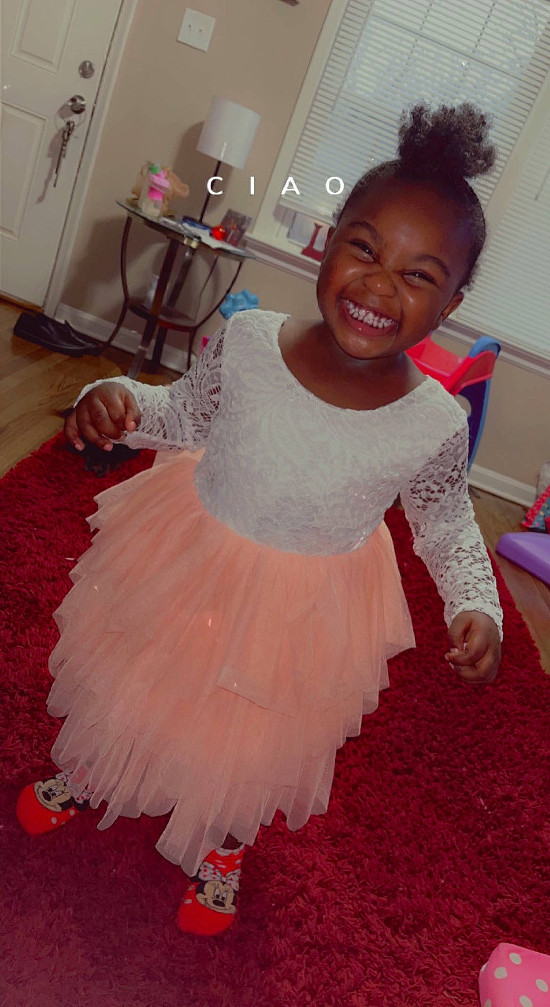 Denver is registered to the contest to win money with this photo: baby_toddler_clothing, child, day_dress, embellishment, event, fashion_accessory, fashion_design, flooring, fun, happy, joy, magenta, peach, person, pink, room, ruffle, skin, smile, textile