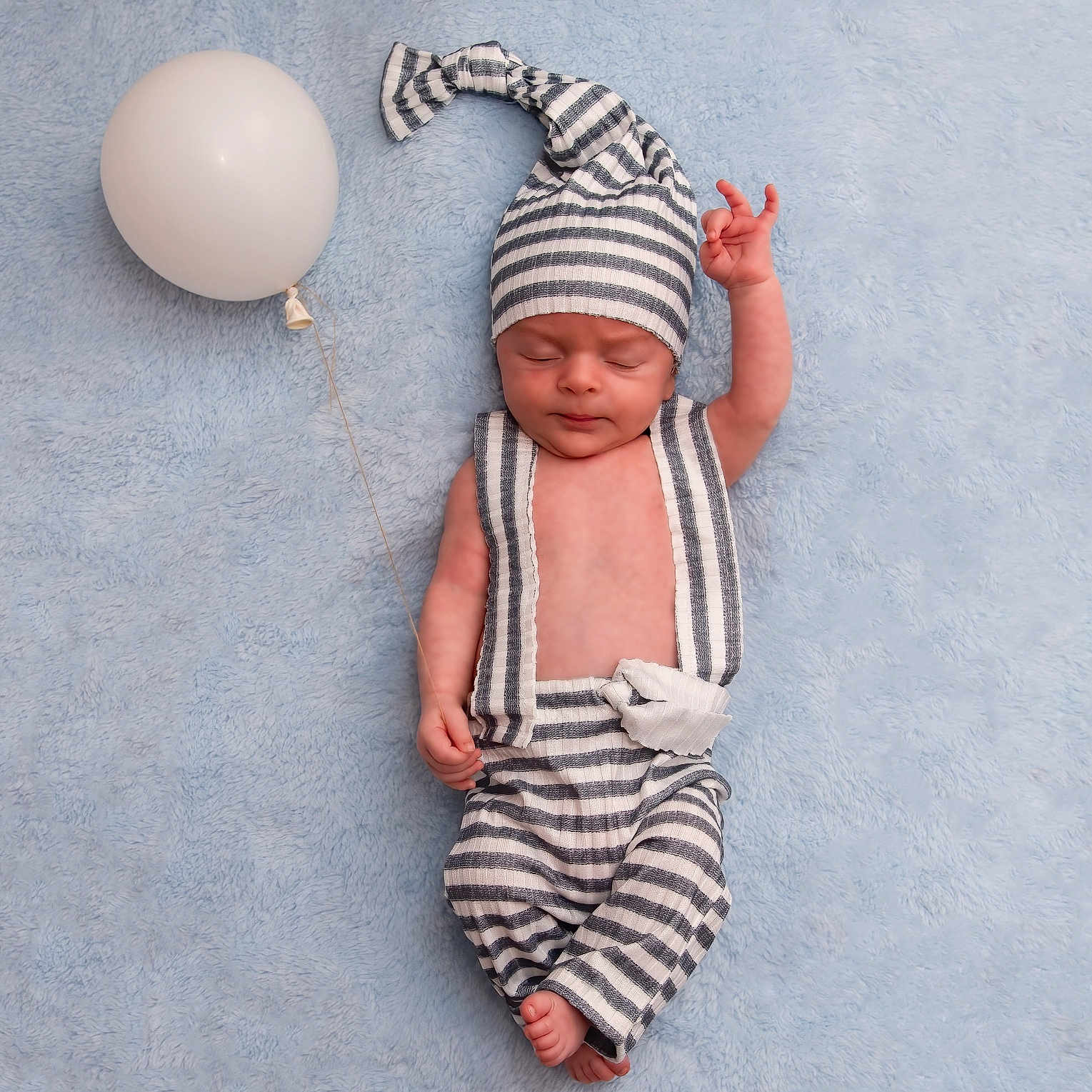 Oliver joined the competition — help win amazing prizes! adorable, baby, balloon, bare_chest, blue_blanket, child, cute, hand_raised, hat, indoor, infant, lying_down, newborn, peaceful, portrait, resting, sleeping, small_feet, soft_texture, striped_clothing