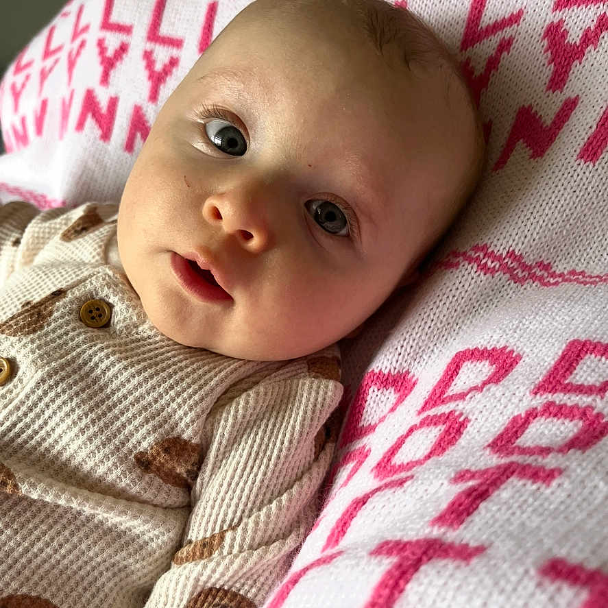 Dorothy is registered to the contest to win money with this photo: baby, blanket, bodypart, clothing, cushion, face, finger, furniture, hand, happy, hat, head, homedecor, newborn, person, photography, portrait, quilt, smile, towel