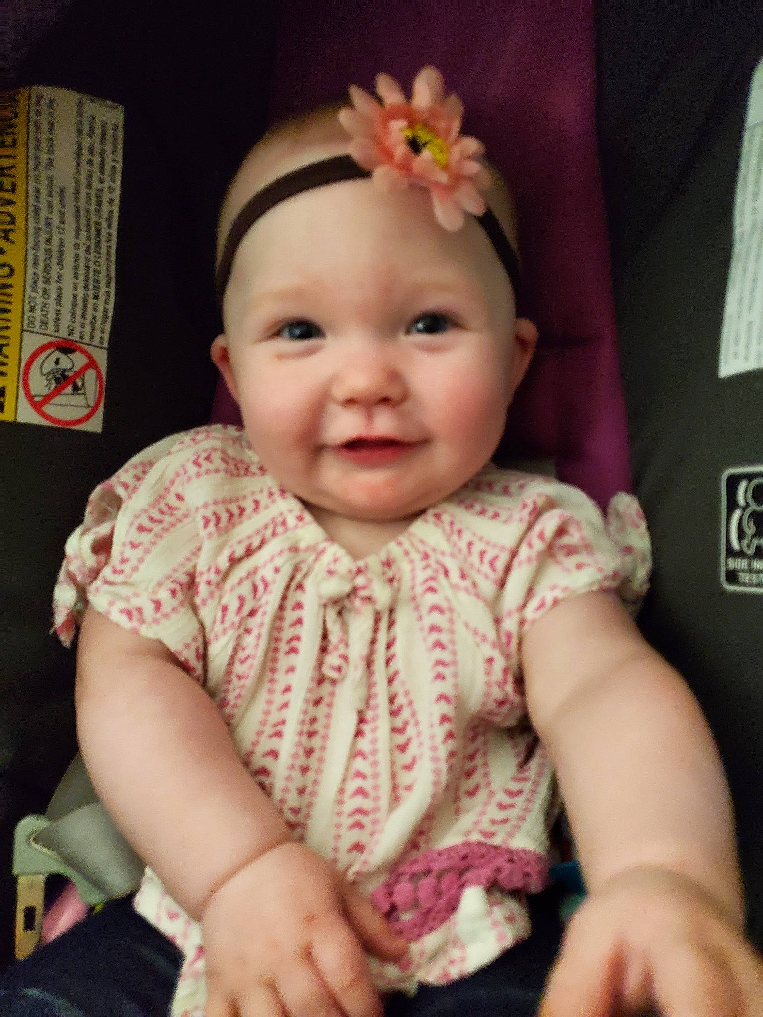 Cadence is registered to the contest to win money with this photo: baby, beauty, cheek, child, dress, eye, face, fashion_accessory, finger, hair_accessory, hand, head, headgear, iris, lip, person, pink, sitting, skin, smile