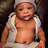 baby, child, infant, hat, striped_clothing, shorts, shirtless, sitting, leather_chair, indoor, cute, chubby_cheeks, portrait, skin, hand, face, eyes, mouth, young, person