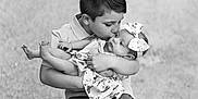 Ember joined the competition — help win amazing prizes! boy, baby, child, kiss, brother, sister, love, affection, chair, outdoor, portrait, black_and_white, flower_pattern, headband, cute, family, tender, holding, smiling, young