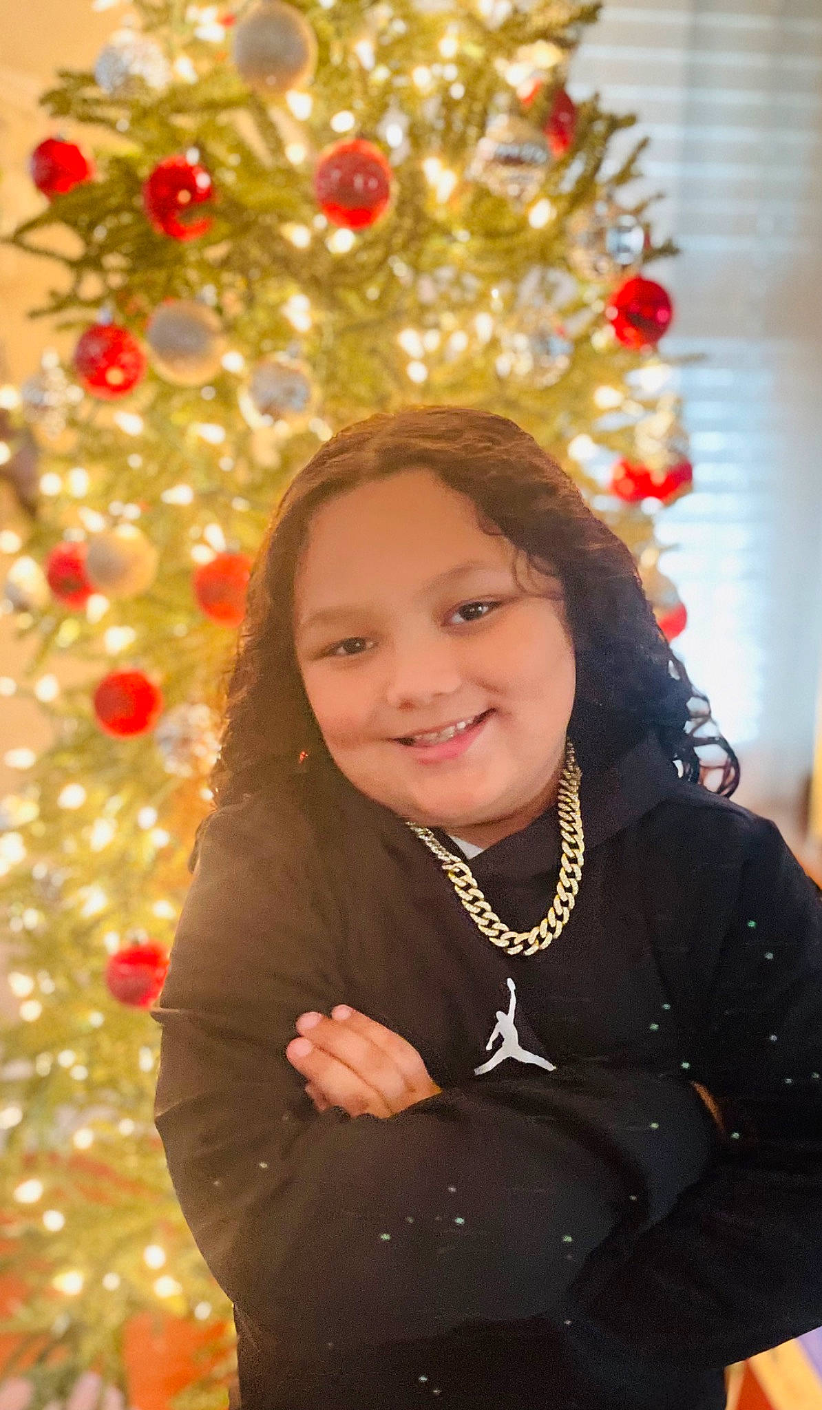 Jaxon joined the competition — help win amazing prizes! beauty, christmas_decoration, christmas_ornament, christmas_tree, event, eye, facial_expression, flash_photography, fun, happy, head, holiday_ornament, human_body, joy, long_hair, organ, ornament, person, photograph, smile