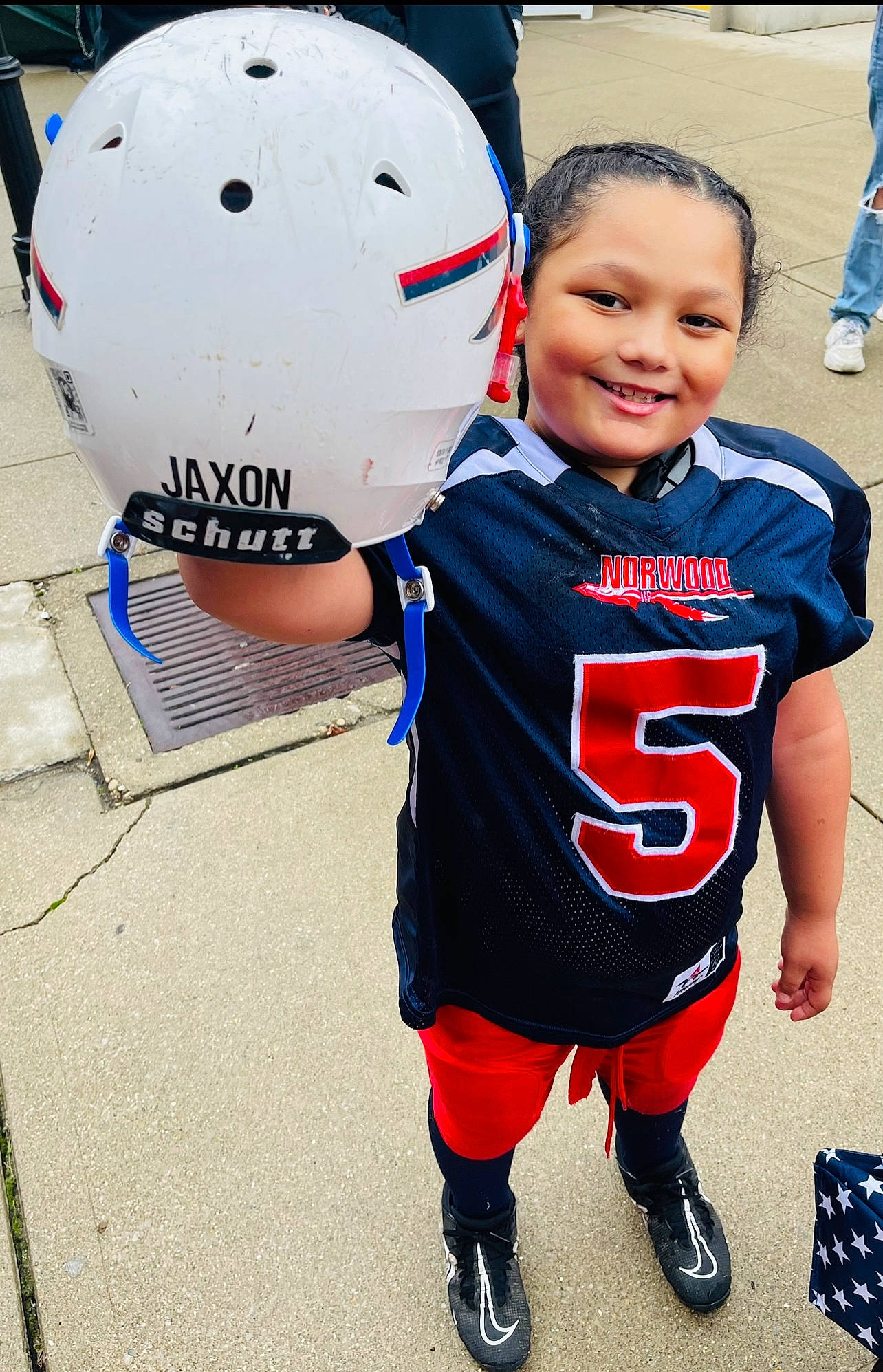 Jaxon is registered to the contest to win money with this photo: ball_game, competition_event, football, fun, happy, jersey, joy, person, personal_protective_equipment, player, shoe, shorts, smile, sneakers, sports, sports_equipment, sports_gear, sports_uniform, sportswear, team_sport