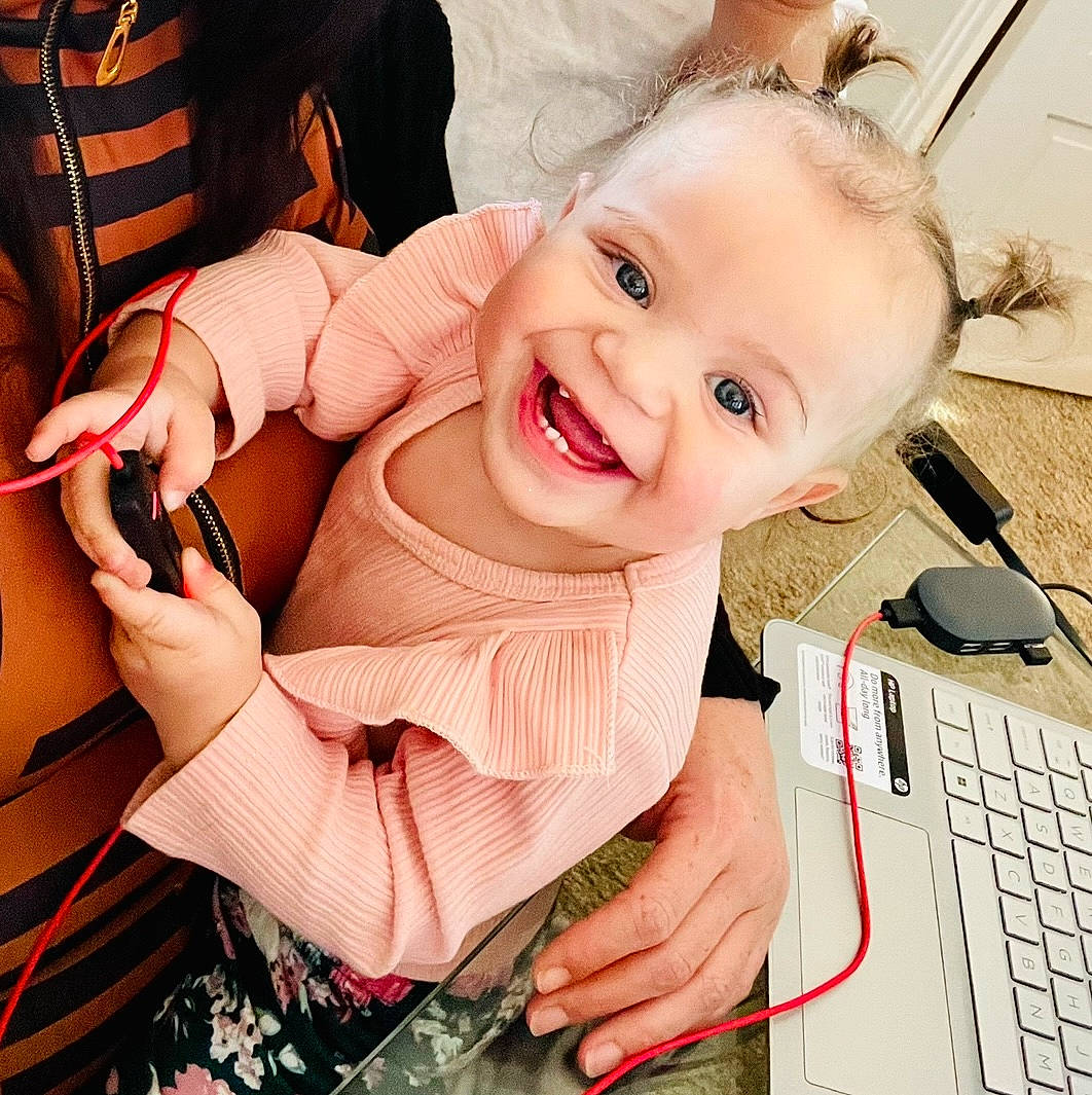 Jaelyn joined the competition — help win amazing prizes! baby, baby_toddler_clothing, eyelash, finger, gesture, happy, head, input_device, joy, mouth, nail, office_equipment, office_supplies, peripheral, person, skin, sleeve, smile, t_shirt, thumb
