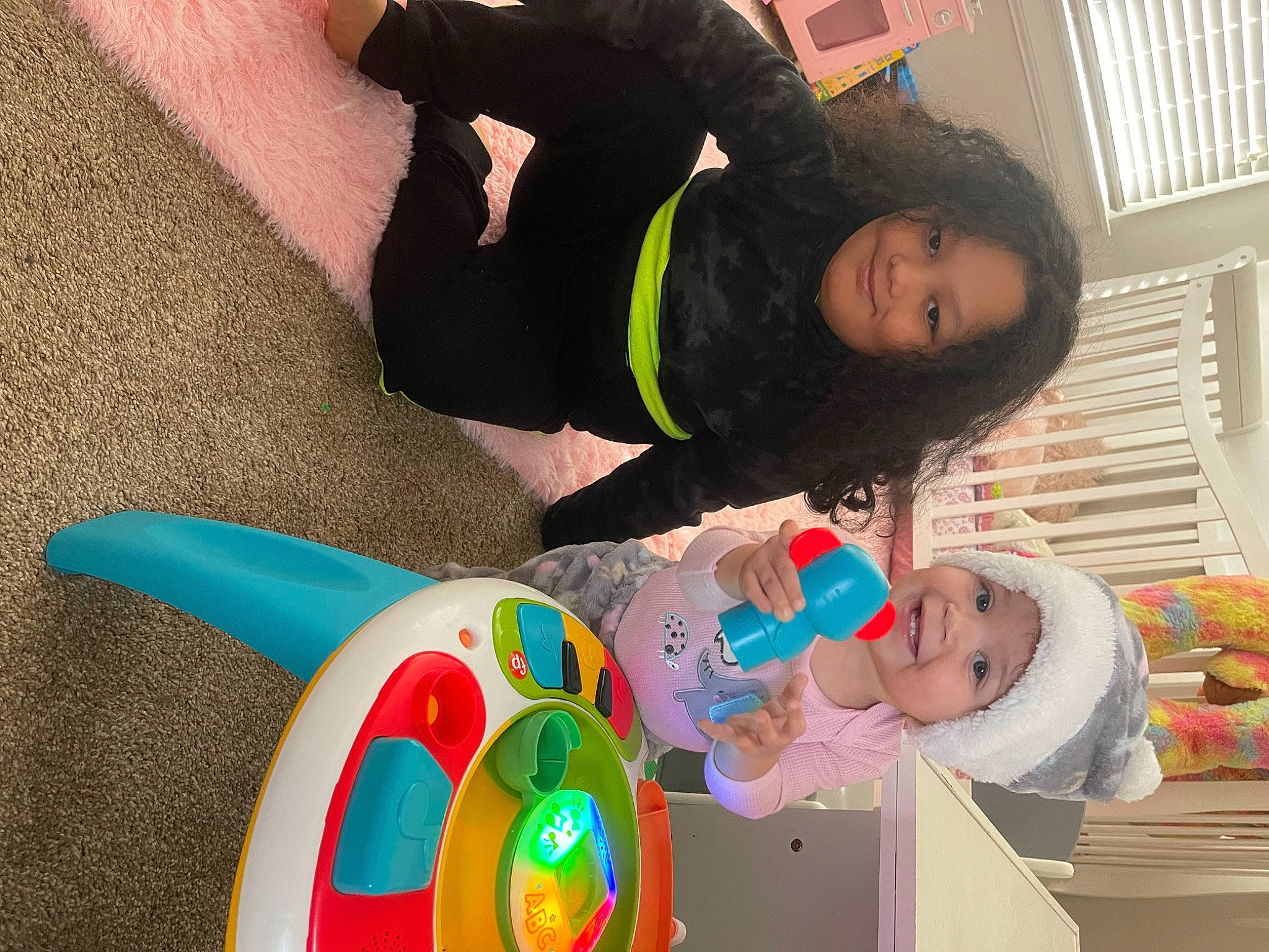 Jaelyn is registered to the contest to win money with this photo: baby, baby_playing_with_toys, baby_products, baby_toddler_clothing, baby_toys, child, clothing, comfort, facial_expression, fun, green, happy, hat, headwear, joy, leisure, person, play, room, thigh