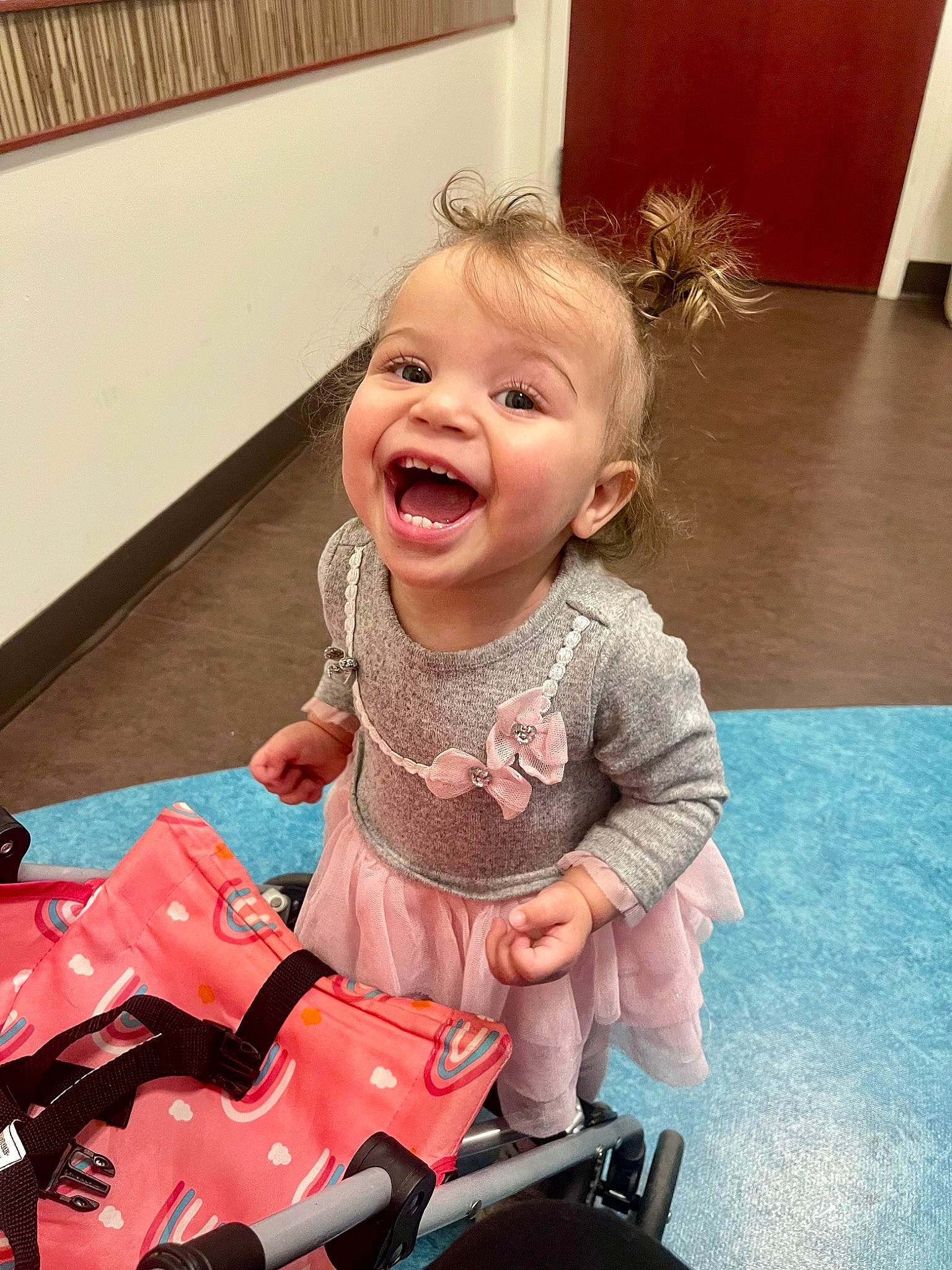 Jaelyn joined the competition — help win amazing prizes! baby, baby_toddler_clothing, cheek, child, eye, flooring, fun, happy, head, human_body, iris, person, photograph, pink, product, riding_toy, skin, smile, snapshot, toddler