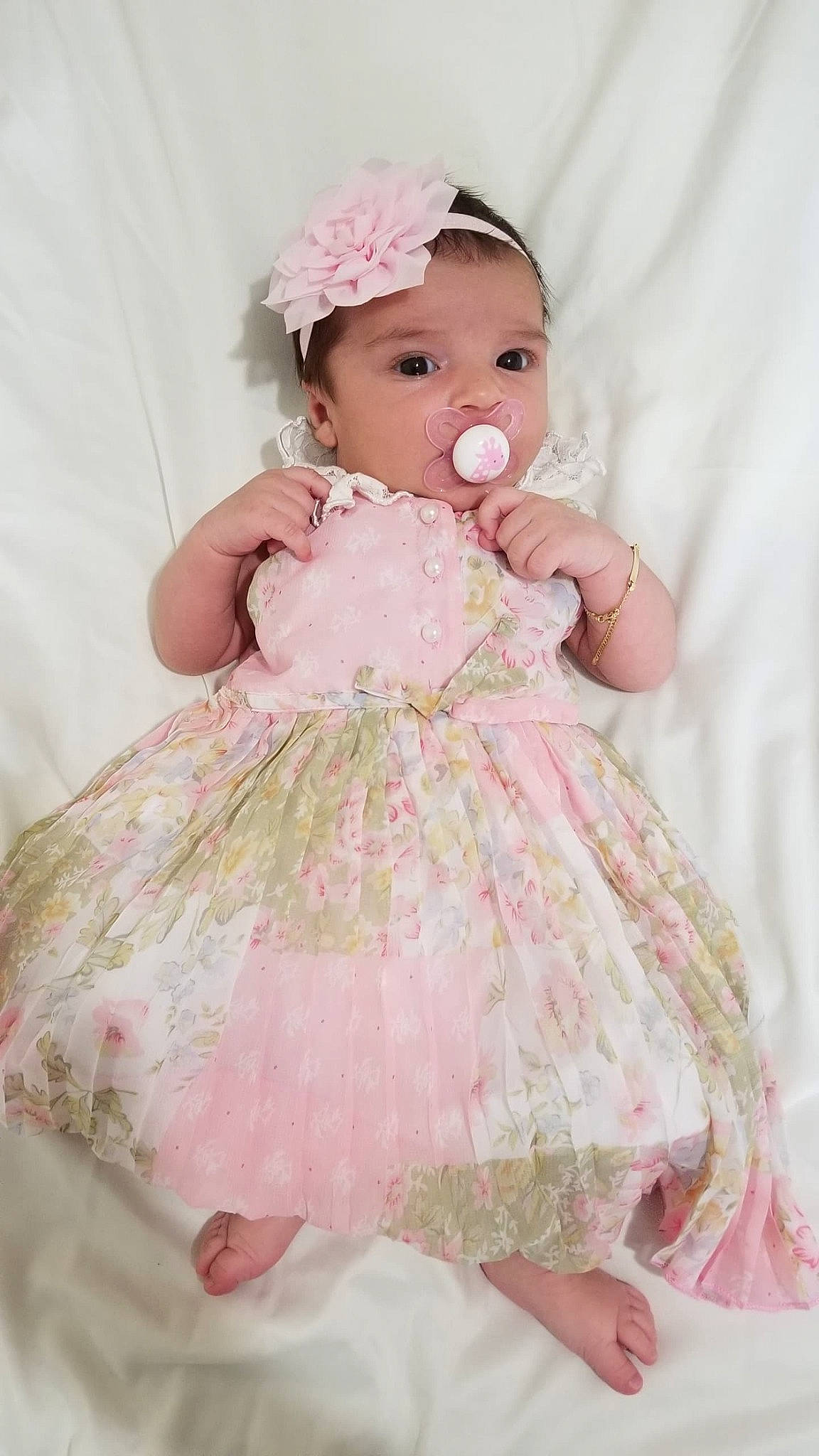 María is registered to the contest to win money with this photo: baby, baby_products, baby_toddler_clothing, child, clothing, costume, dress, hair_accessory, headgear, headwear, peach, person, pink, product, toddler