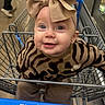 baby, bow_headband, child, clothing, cute, earrings, eyes, face, grocery_store, headband, infant, leopard_print, metal_cart, portrait, shopping, shopping_cart, smile, smiling, sweater, walmart