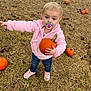 Ivy is registered to the contest to win money with this photo: baby, clothing, face, food, footwear, grass, head, jeans, outdoors, pants, person, photography, plant, portrait, produce, pumpkin, shoe, soil, squash, vegetable