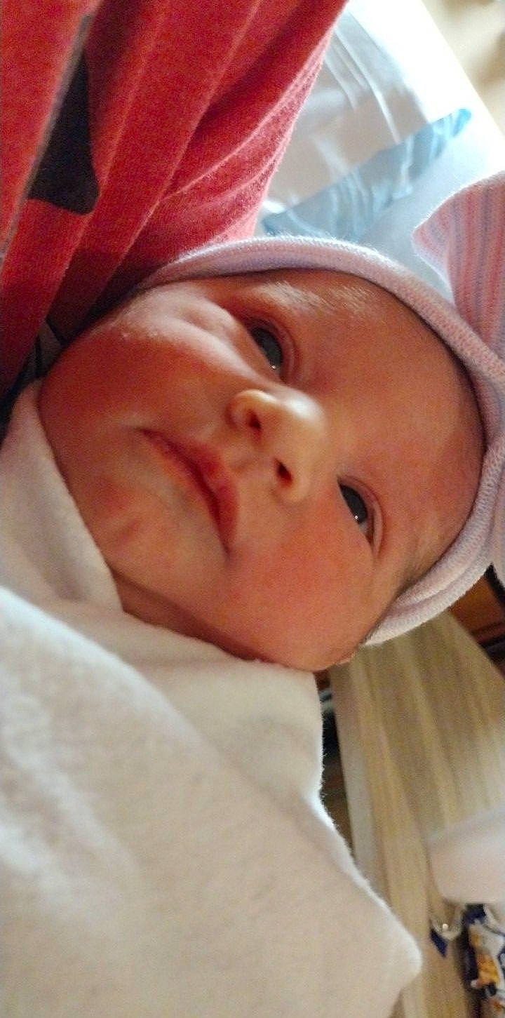 Judith is registered to the contest to win money with this photo: baby, baby_products, baby_toddler_clothing, bedtime, carmine, cheek, child, comfort, eye, eyebrow, eyelash, happy, iris, linens, lip, nose, person, pink, skin, smile