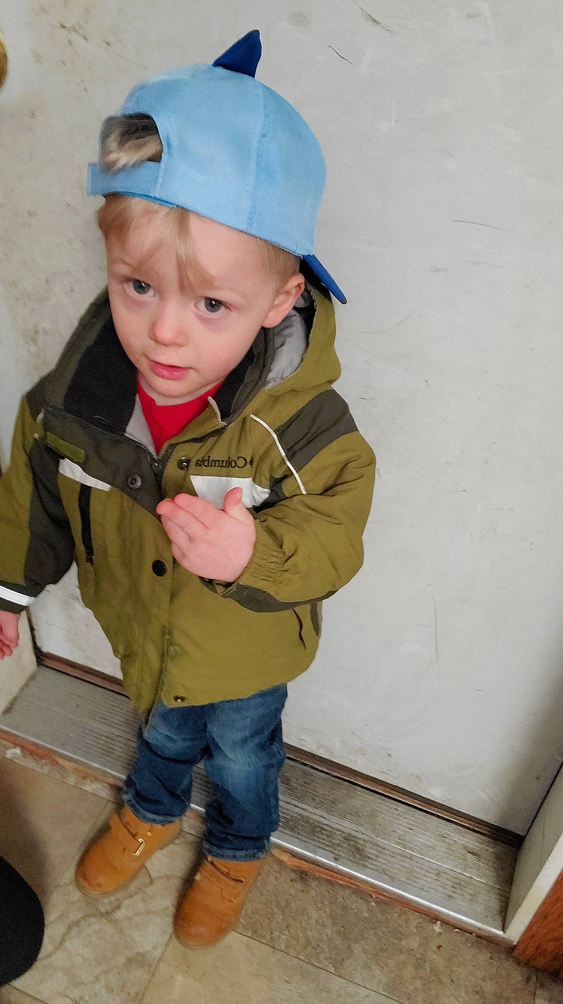 Jaxon is registered to the contest to win money with this photo: baby_toddler_clothing, baseball_cap, cap, cheek, child, clothing, denim, electric_blue, eye, fashion_accessory, fun, head, headgear, headwear, jacket, jeans, person, personal_protective_equipment, sitting, sleeve
