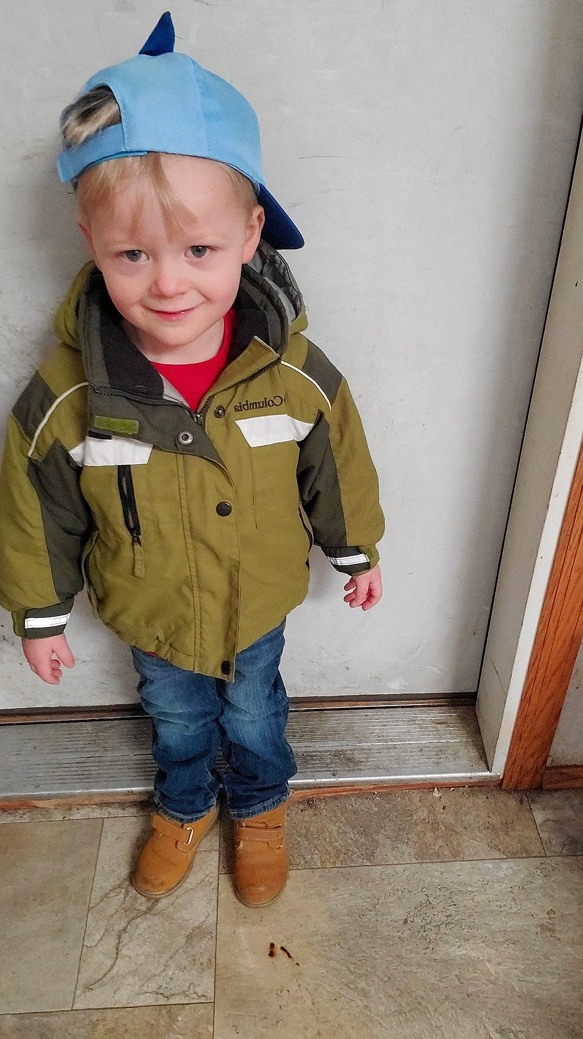 Jaxon joined the competition — help win amazing prizes! baby, baby_toddler_clothing, cap, cheek, child, denim, eye, face, flooring, fun, headgear, jacket, jeans, joy, person, personal_protective_equipment, recreation, sitting, sleeve, toddler