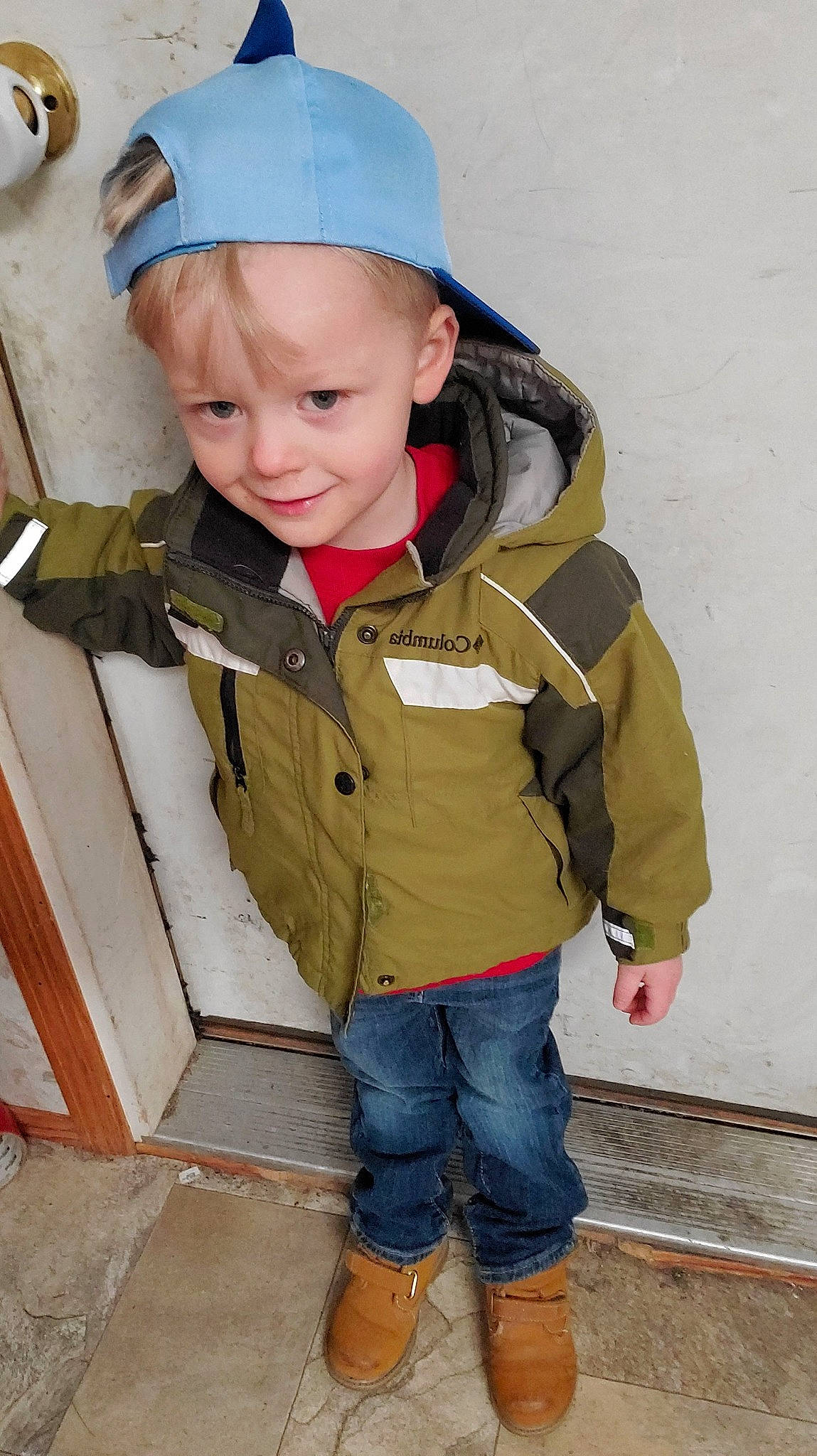 Jaxon is registered to the contest to win money with this photo: baby, baby_toddler_clothing, cap, cheek, child, chin, clothing, eye, face, facial_expression, hairstyle, head, headgear, jacket, joy, nose, person, skin, sleeve, toddler