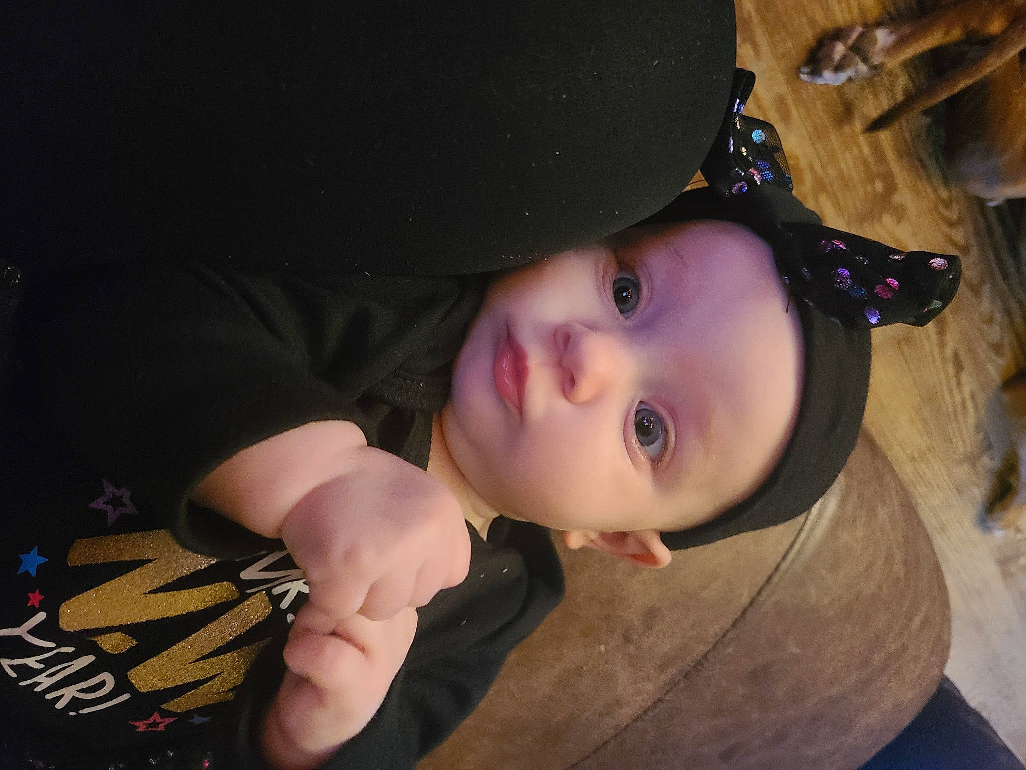 Rylee is registered to the contest to win money with this photo: baby, black_hair, cheek, child, eyebrow, eyelash, flash_photography, fun, hand, happy, hat, headgear, headwear, iris, lip, mouth, neck, nose, person, plant