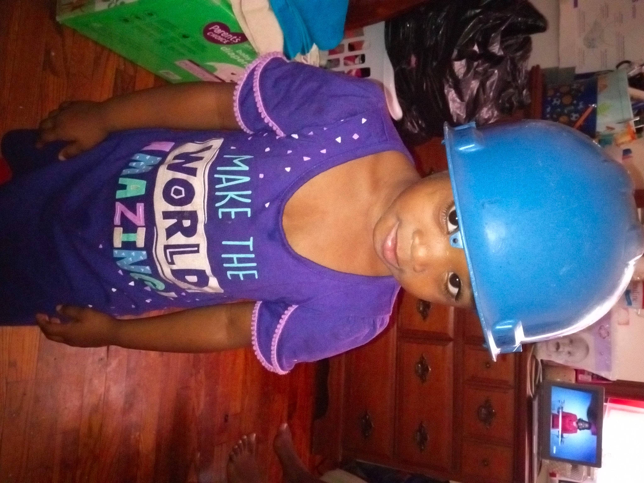 Cerenity is registered to the contest to win money with this photo: abdomen, balloon, chest, elbow, electric_blue, fun, hat, headwear, helmet, human_leg, machine, party_supply, person, purple, room, shorts, smile, sportswear, t_shirt, thigh