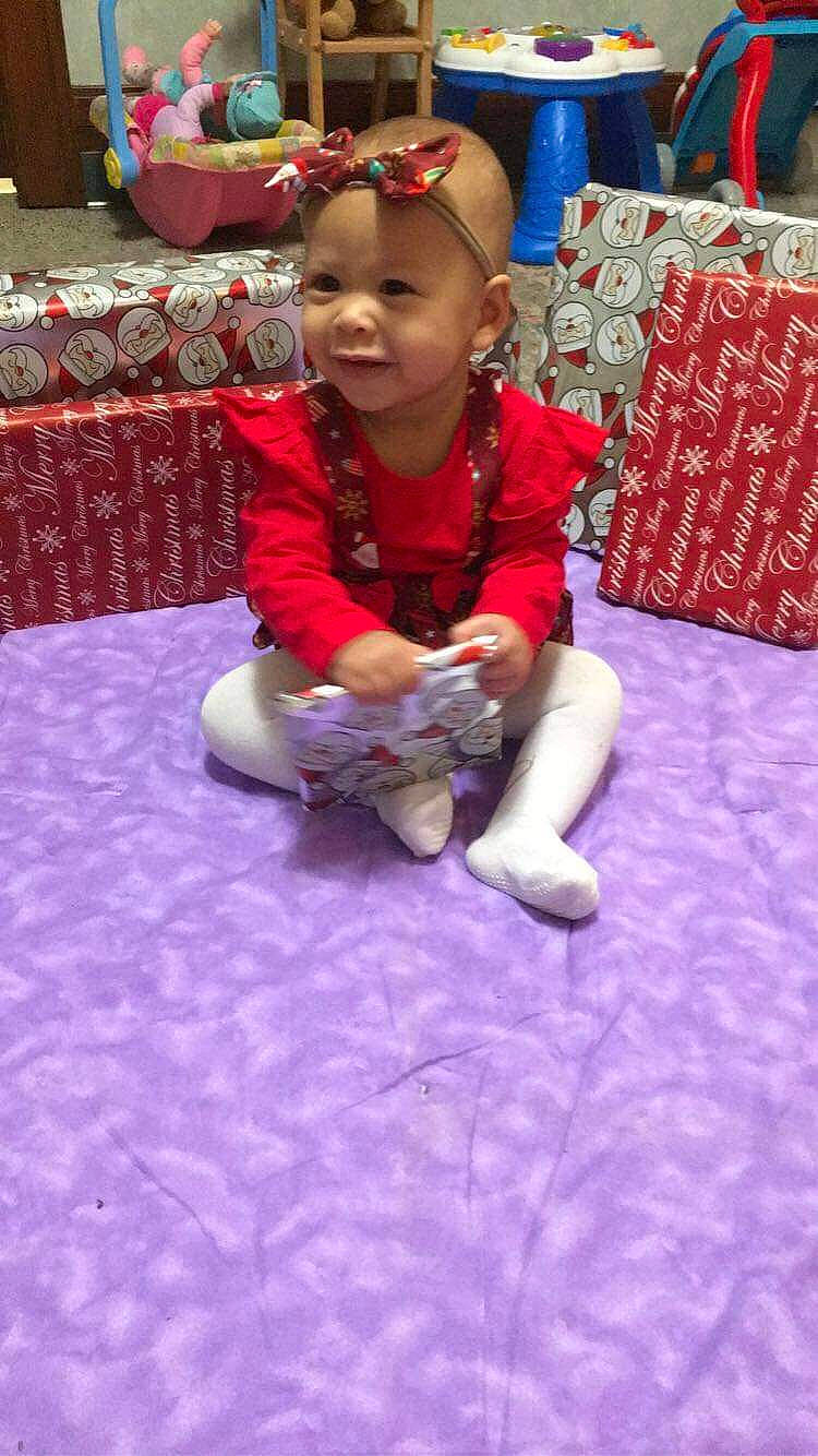 Emberlee is registered to the contest to win money with this photo: baby, birthday, cap, chair, child, event, flooring, fun, happy, hat, headwear, kindergarten, leisure, magenta, party, person, play, purple, recreation, sitting