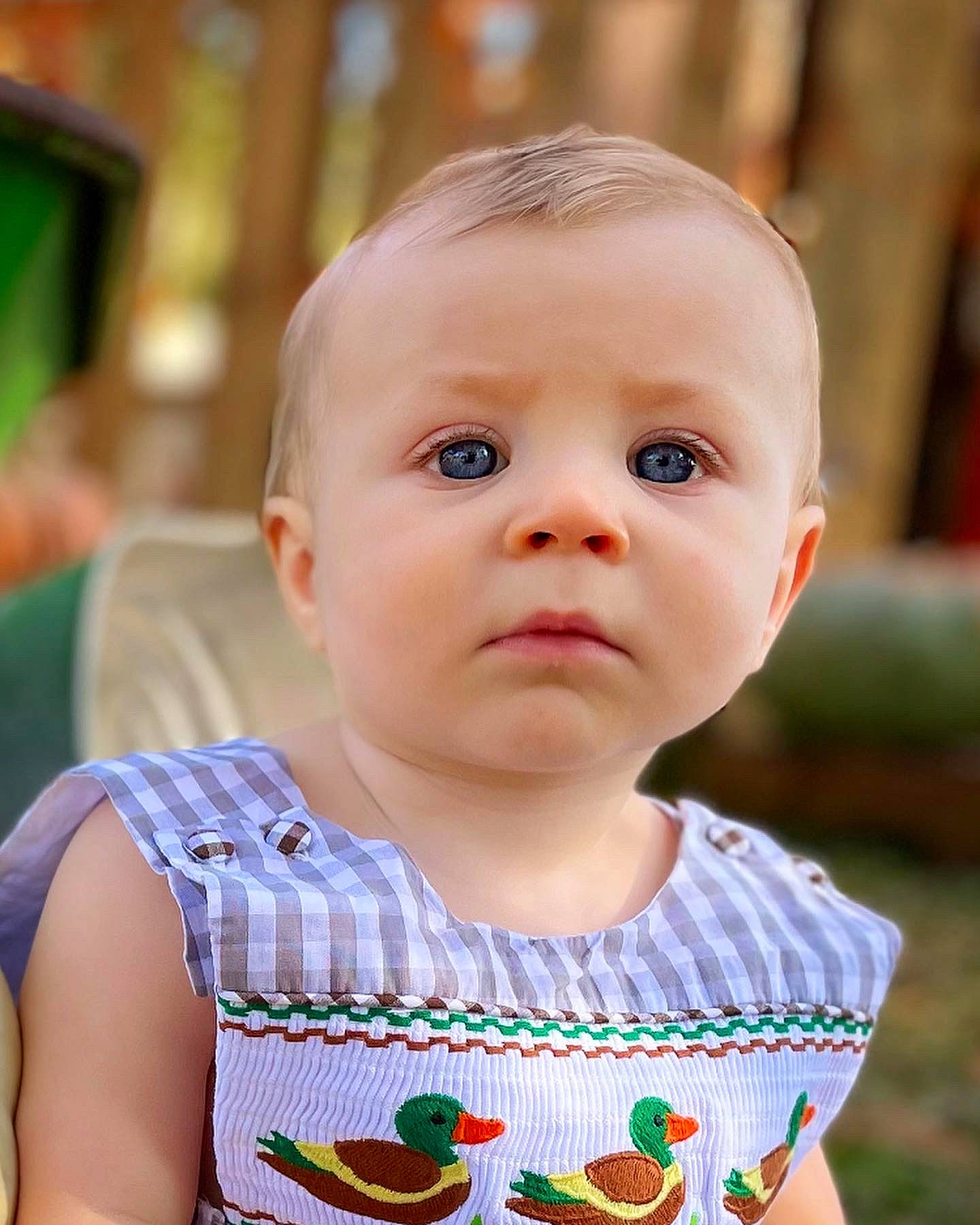 Easton is registered to the contest to win money with this photo: baby, baby_toddler_clothing, bib, blond, cheek, child, chin, drinkware, eyelash, grass, happy, iris, lip, nose, person, skin, sleeve, summer, t_shirt, tableware