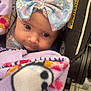 Abagail joined the competition — help win amazing prizes! baby, child, blanket, bow, car_seat, clothing, cute, face, female, headwear, indoors, infant, person, portrait, seat, soft, toddler, warm, warning_label, wide_eyes