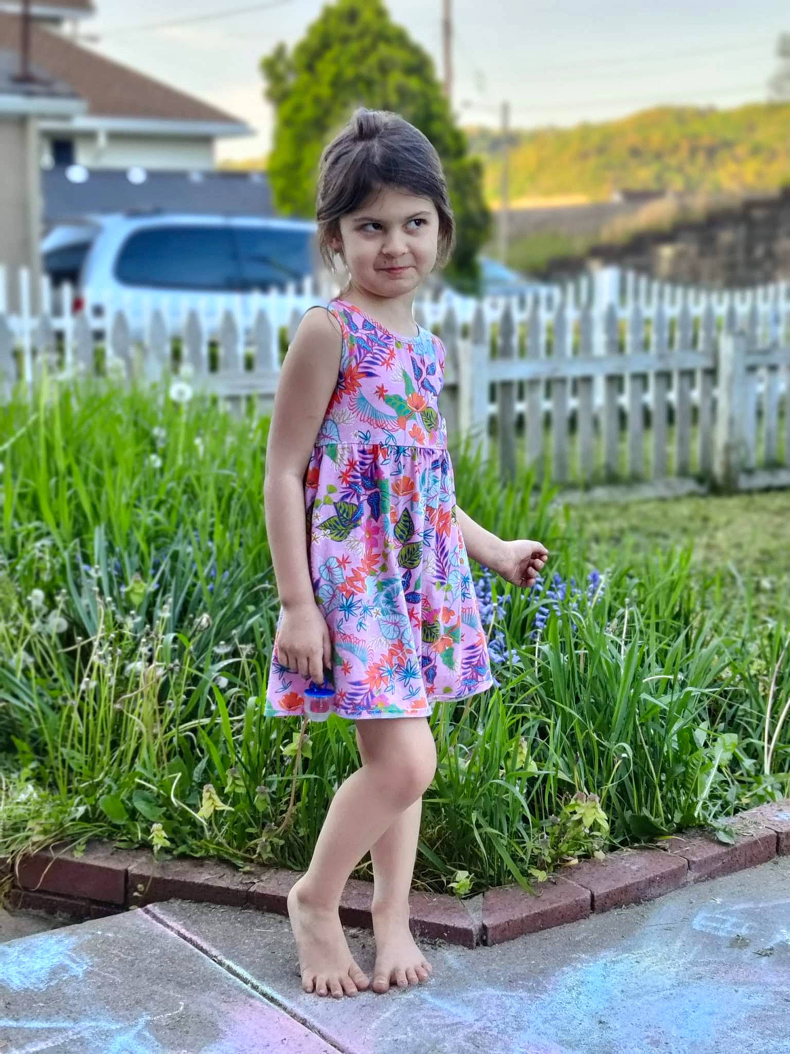 Sky is registered to the contest to win money with this photo: barefoot, child, clothing, day_dress, dress, foot, grass, happy, human_leg, joy, leg, leisure, one_piece_garment, pattern, people, people_in_nature, person, plant, sky, summer